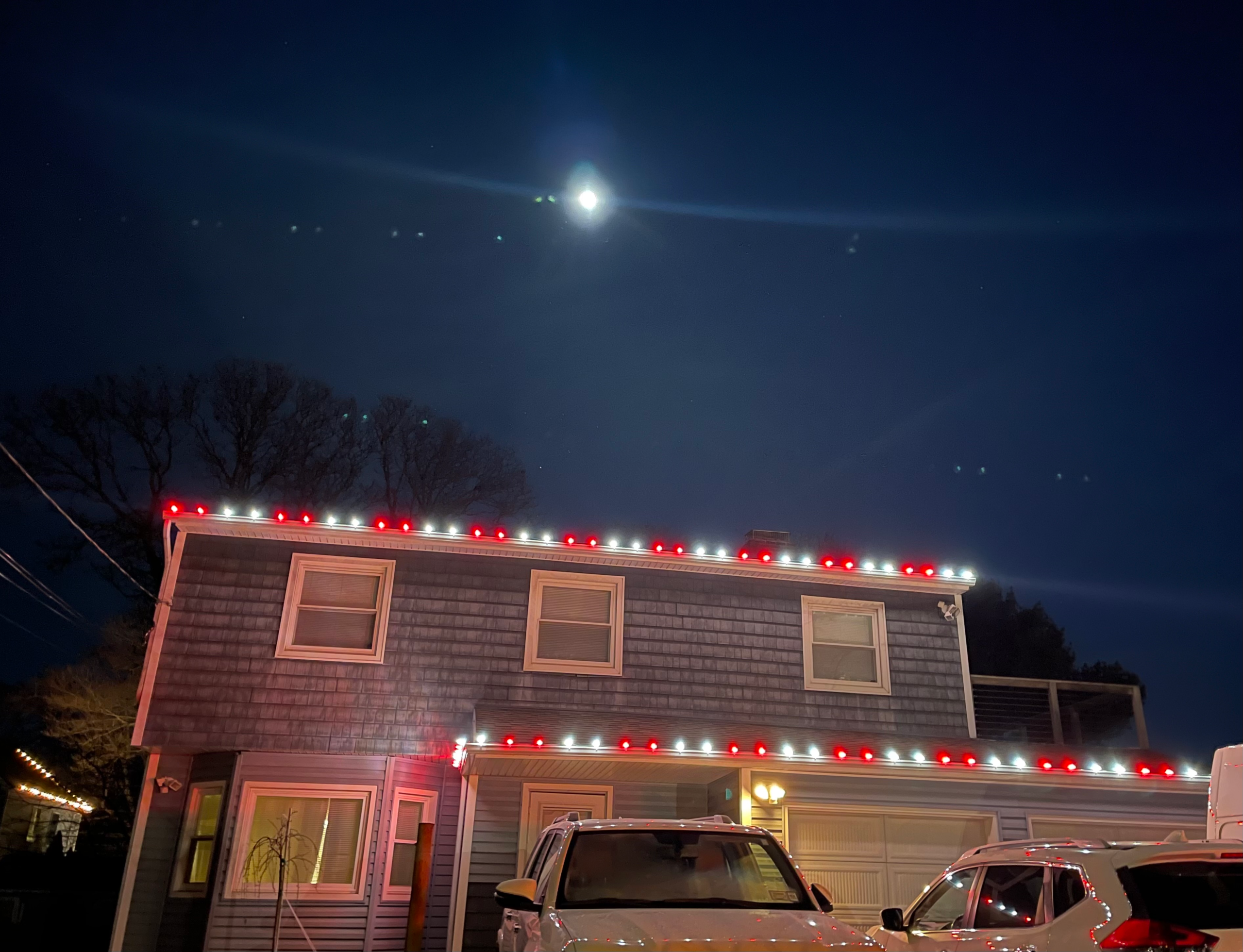 Red and white Christmas roofline lighting