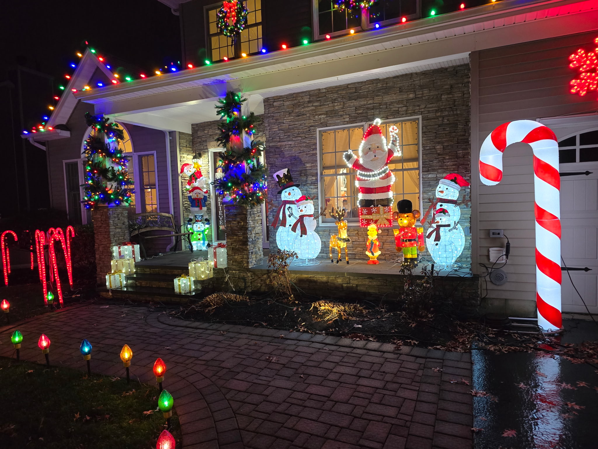 Multicolor Christmas lights installed along a residential exterior